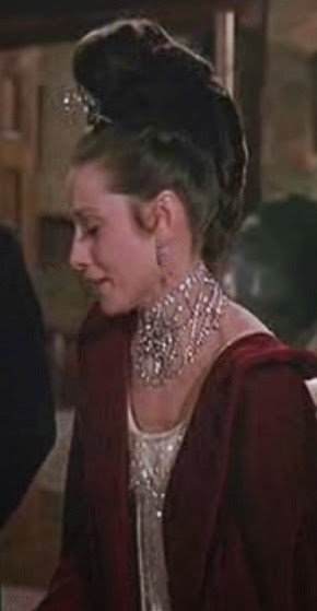 Audrey Hepburn as Eliza Doolittle.