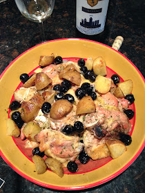 Roasted chicken with potatoes and black olives