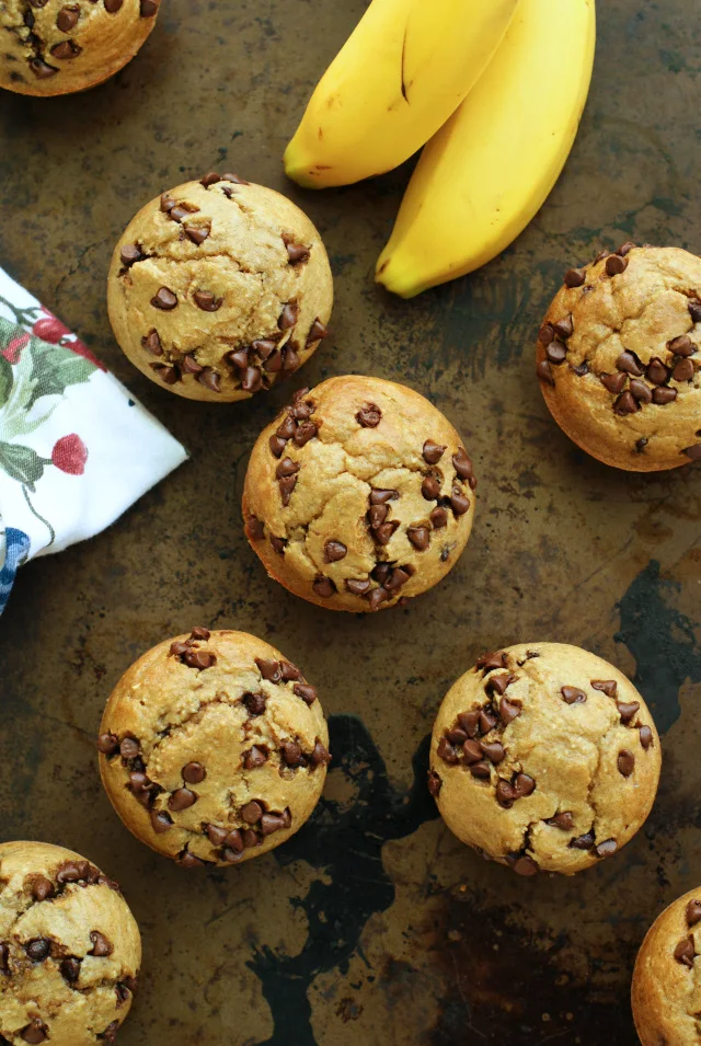 Flourless Banana Chocolate Chip Muffins are made with a batter that has no flour, no butter, and no oil and is mixed together in your blender instead of a mixer.  They are moist, delicious, and could pass for breakfast or dessert! #blendermuffins #breakfast #muffinrecipe