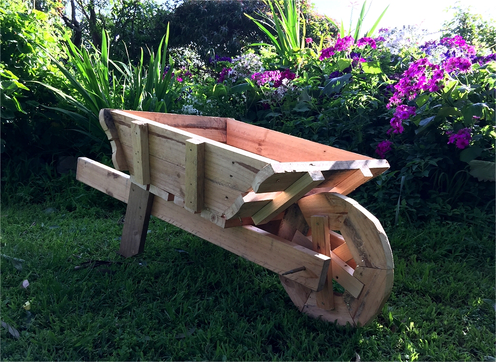 Wooden Wheelbarrow Planter with free plans/instructions