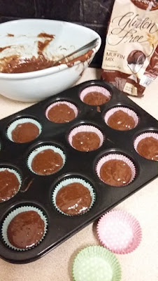 Picture of Provena Gluten Free chocolate muffin mix with chocolate chips in baking cases in a muffin tray, waiting to be cooked.