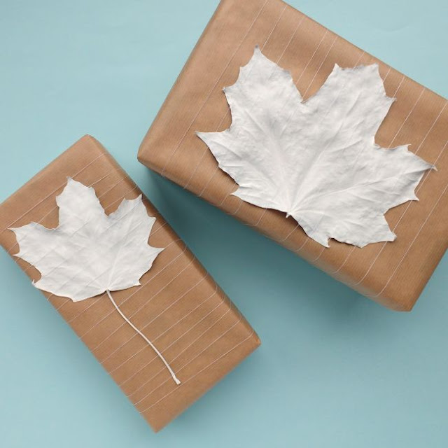 Get creative with your gift wrapping with these 10 DIY gift wrap ideas! simple parcels decorated with painted leaves