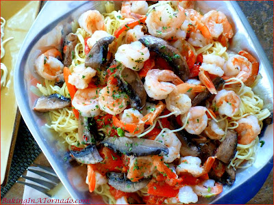 Shrimp and Portobello in Roasted Red Pepper Cream Sauce: Shrimp and portobello mushrooms in a roasted red pepper infused cream sauce served over angel hair pasta | Recipe developed by www.BakingInATornado.com | #recipe #dinner #shrimp #pasta