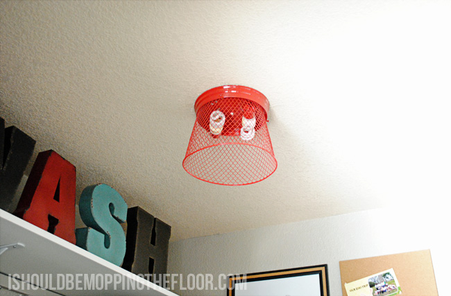 Transforming a dated light fixture with a dollar store item!