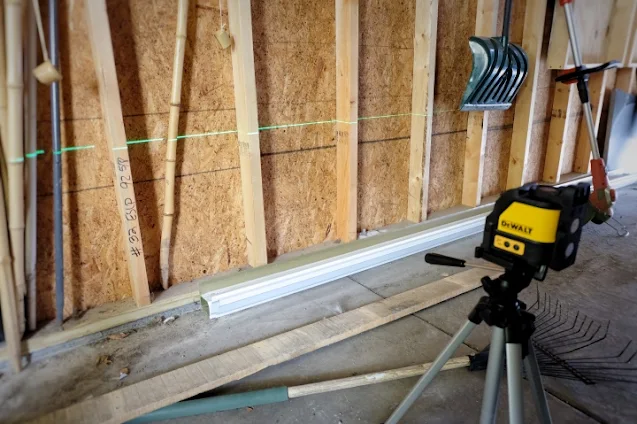 using laser level along garage wall