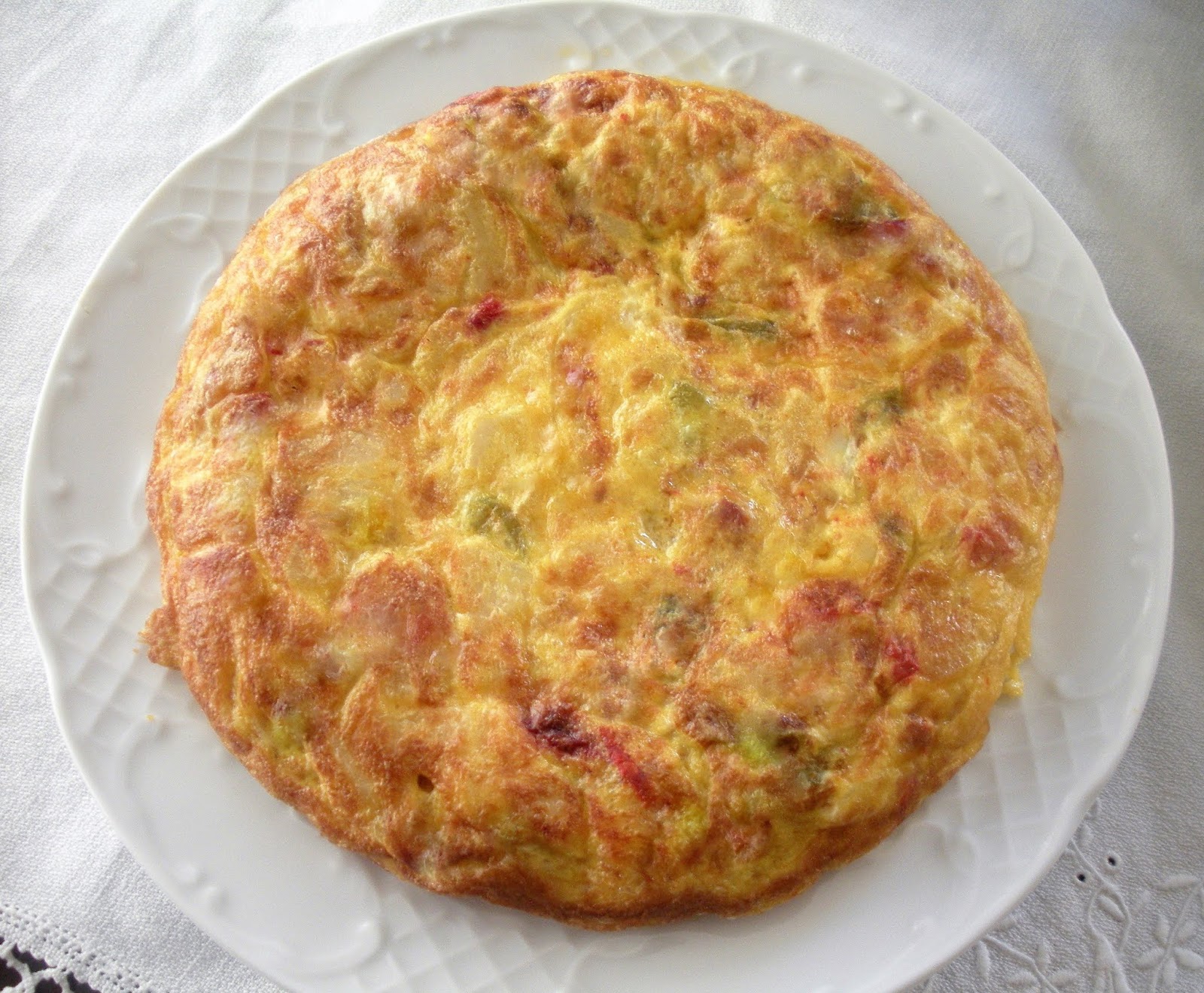 Aquí se cocina Tortilla de patatas, pimientos y chorizo.