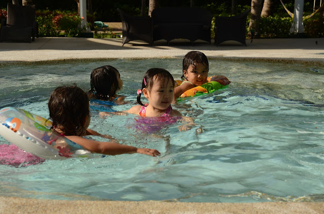 Four little girlst swimming