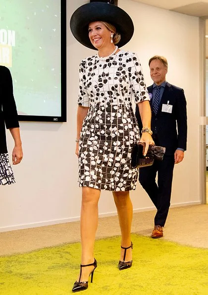 Queen Maxima wore a new leaf print tweed half sleeve dress by Carolina Herrera. De Kindertelefoon (Child helpline)