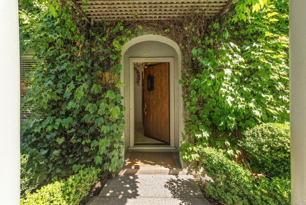Ivy covered California home of Myra Hoefer with lush gardens and French inspired interiors