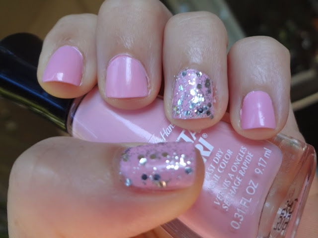 Pink Blink nail polish with silver glitter accent nails