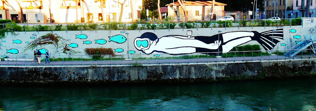 Italian Street Artist MP5 Paints a new mural entitled "Playing Upstream" in Terni, Italy. 4