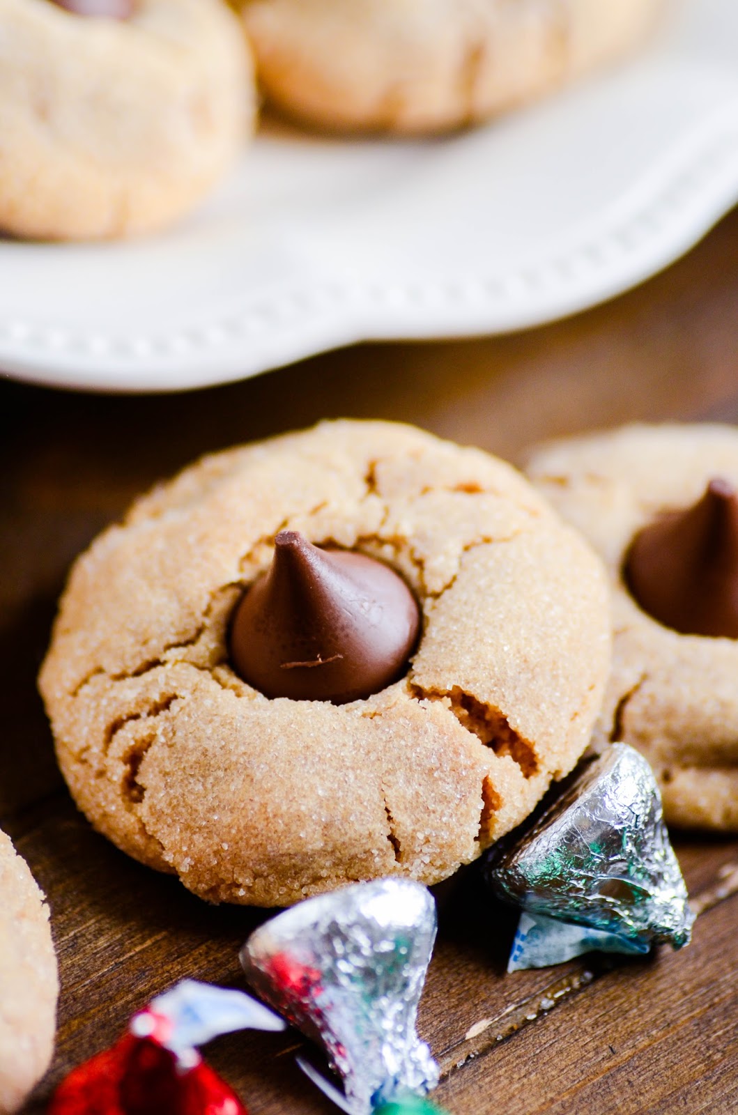 Made with 4 simple ingredients, these peanut butter blossoms are the perfect addition to your holiday cookie plate!