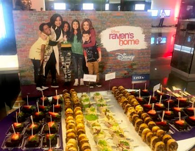 Disney Raven's Home Premiere Eats at Disney Raven's Home Premiere with poster at back
