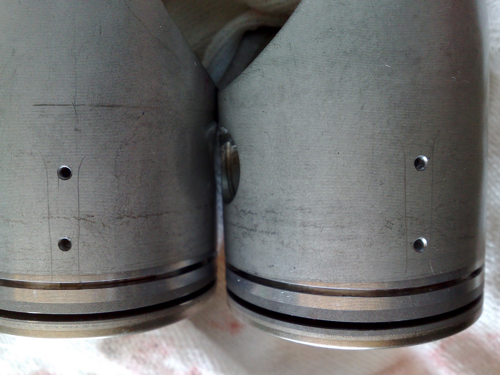 NSR250 Forum Holes in pistons for exhaust port bridge