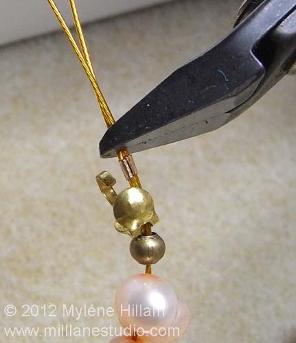 Trimming the excess beading wire with flush cutters
