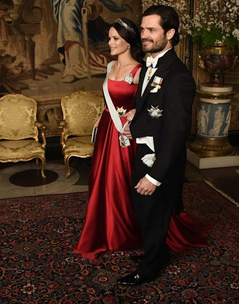 Crown Princess Victoria wore Green gown and Anya Hindmarch Gold Metallic Clutch Princess Sofia wore red gown and  silver diamond Metallic Clutch, diamond tiara.
