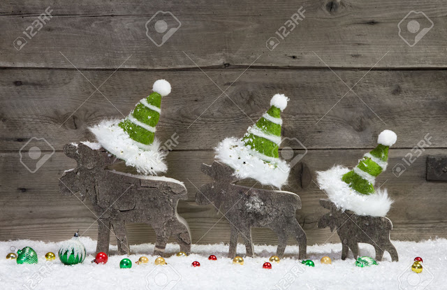 wooden madde deer wearing green colour cap christmas card greetings