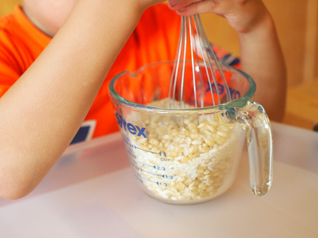 mix rice and corn to put inside your DIY rainmaker