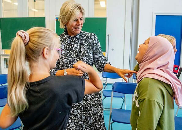 Princess Laurentien attended the launch of a new national education programme at primary school Het Avontuur in Almere. floral print silk dress