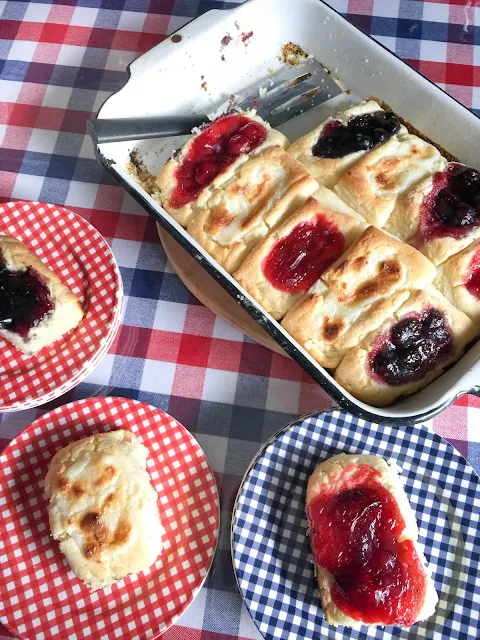 Tender, sweet biscuit dough with a well in the center filled with blackberry or strawberry jam, blueberry or cherry pie filling,  or a mixture of sweetened cream cheese