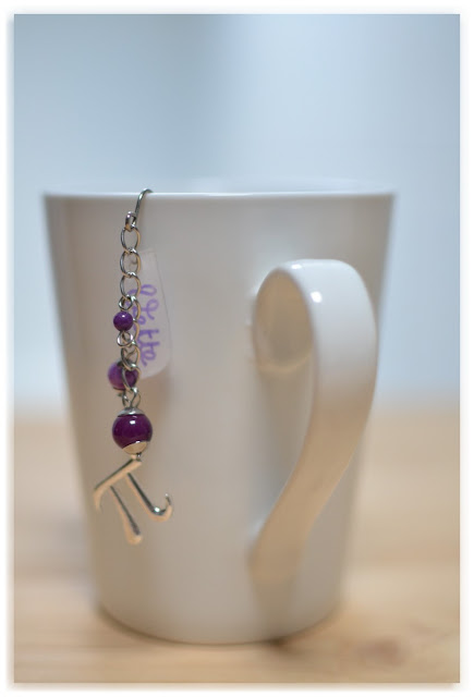 boule à thé fantaisie violette symbole pi vette
