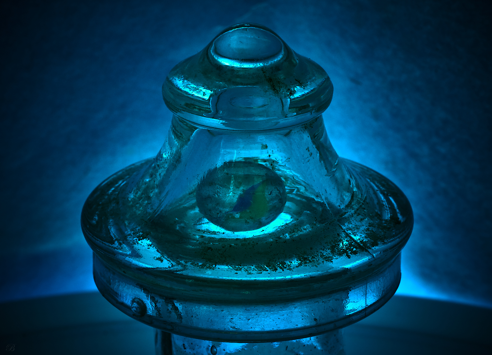 The Late Great Planet Earth / Cats Eye Marble Under Glass