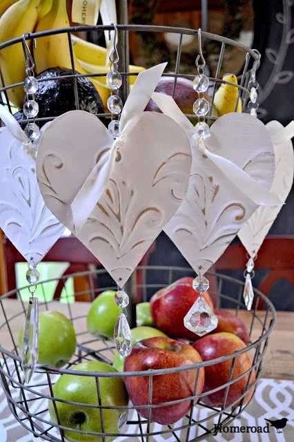Make your own tin heart ornaments. Gorgeous and easy! via Homeroad, featured on http://www.ilovethatjunk.com 