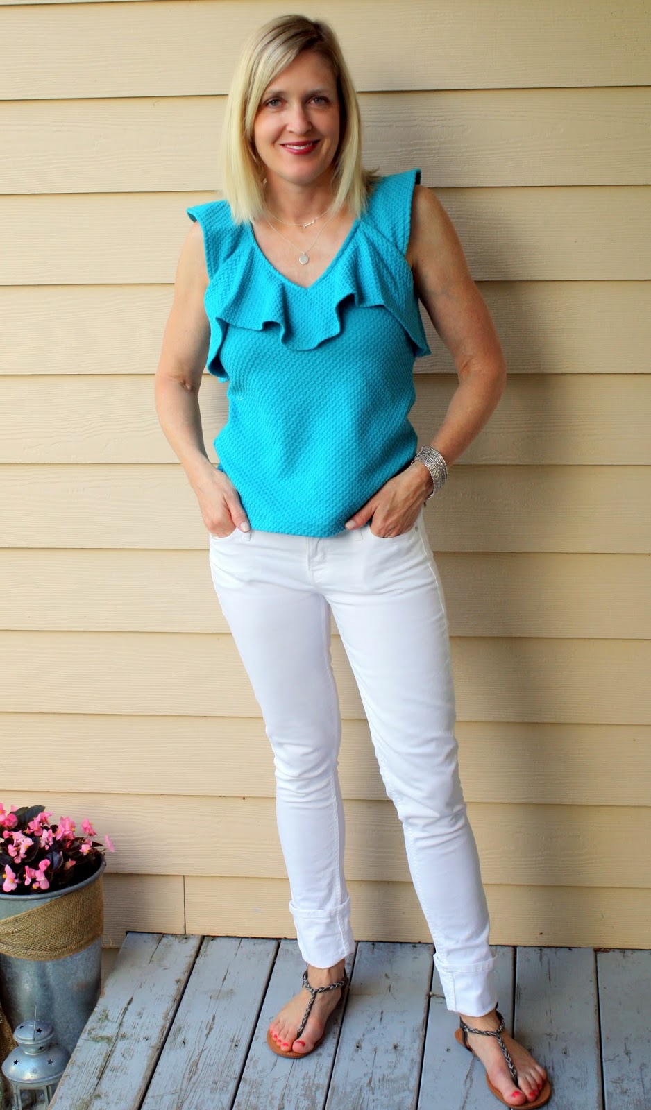 A white jeans outfit with blue top