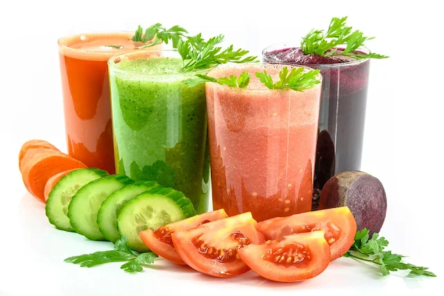 A range of vegetable juices in glasses, carrot, cucumber, tomato and beets