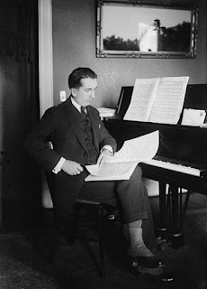 Casella at his piano. He spent some years in the United States 