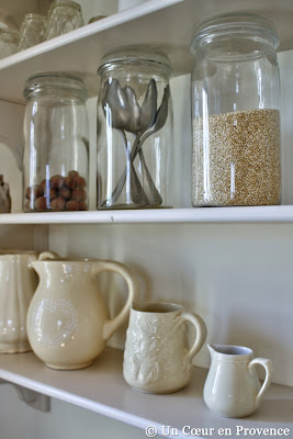 Old glass jars on the kitchen shelves