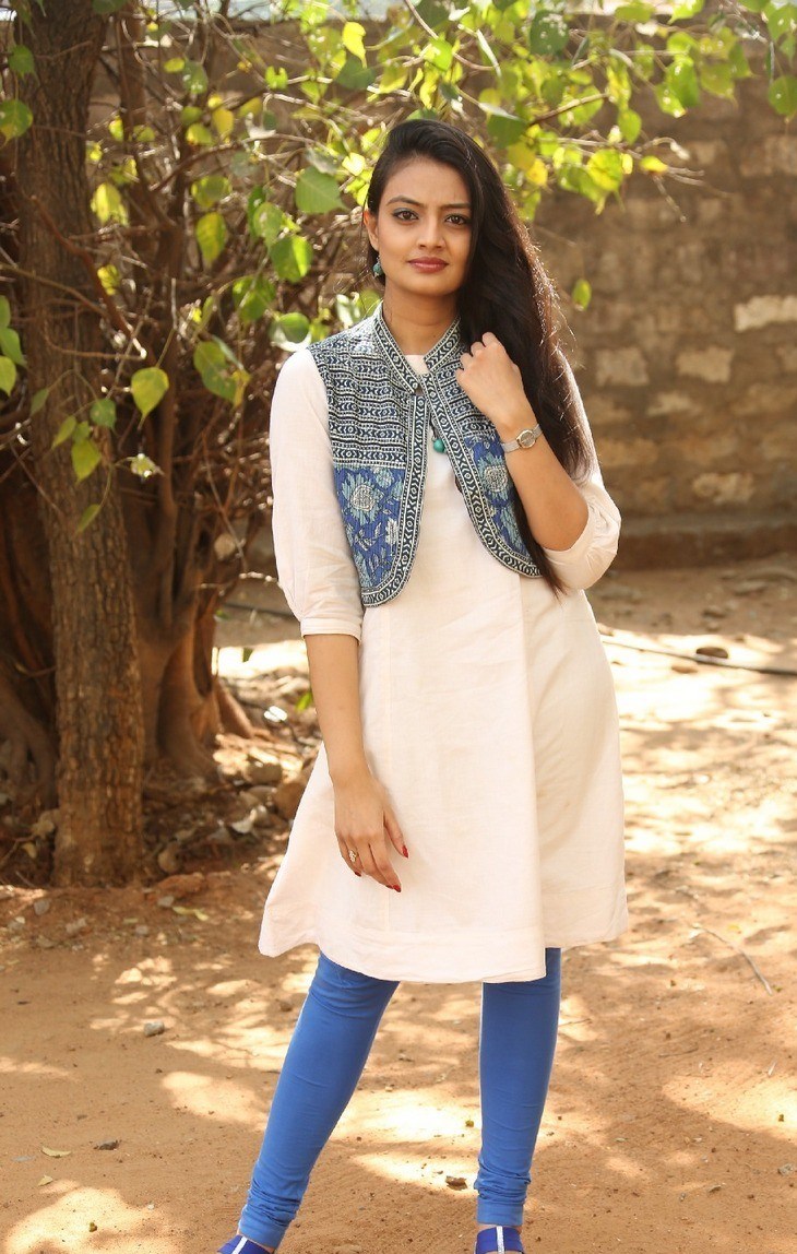 Tollywood Actress Nikitha Narayan Photoshoot In White Top Blue Jeans