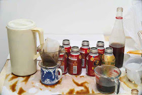 Cold-brew coffee ingredients on a messy table