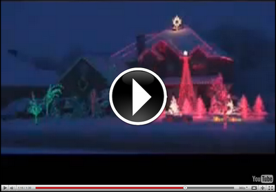 image of video for a Christmas holiday light show. House is decorated with lights and is animated to music