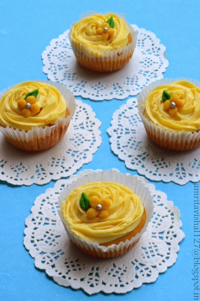 Sweet 'n' Savoury Mango cupcakes with Mango Buttercream frosting