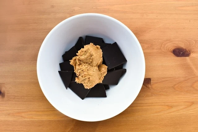 dark chocolate and peanut butter in white bowl