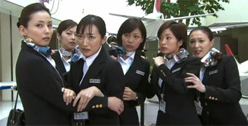 Hirota and Higashino cling to the other cabin attendants.