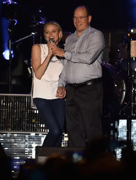 Princess Charlene of Monaco and Prince Albert II of Monaco attend the show of British singer Robbie Williams during celebrations marking Prince Albert II's decade on the throne