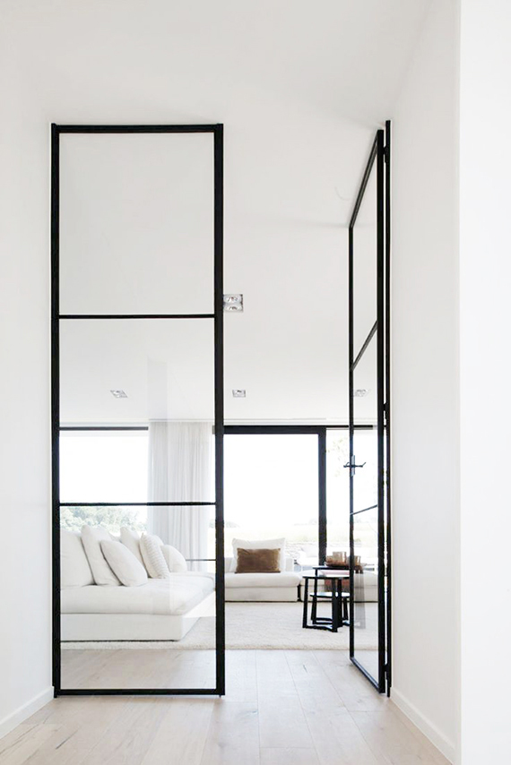 White living room with black metal frame glass doors | Home Sweet Home