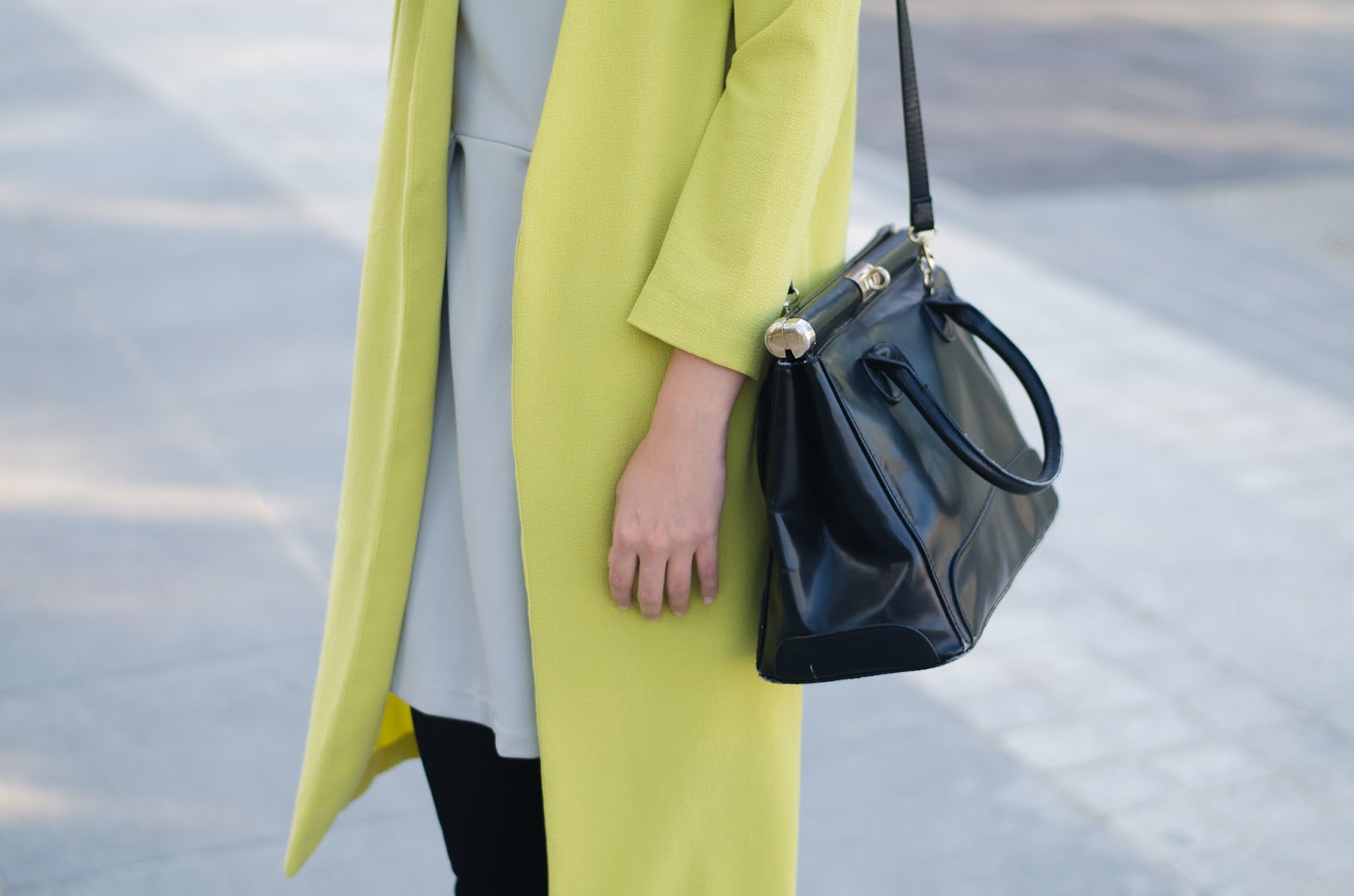 Fashion blogger street syle outfit yellow coat, simple v-neck dress, turban hat and leather slip on sneakers
