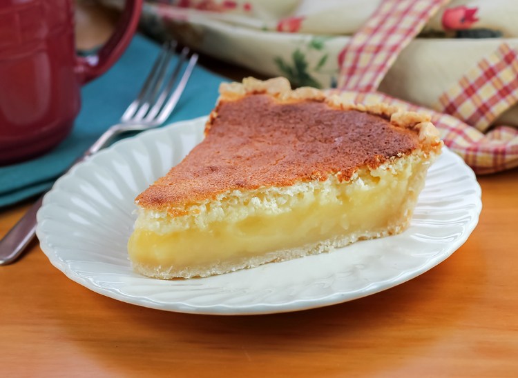 This Lemon Sponge Pie is an easy pie recipe with refreshing lemon flavor and light and airy texture. It makes a deliciously light treat.