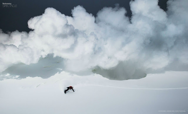 Colby Richards makes a turn with his snowboard below a sulfur cloud in Hokkaido Japan. 