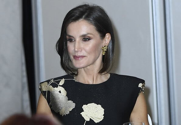 Queen Letizia wore a new embellished floral-jacquard midi dress by Dries Van Noten. gold earrings and pumps