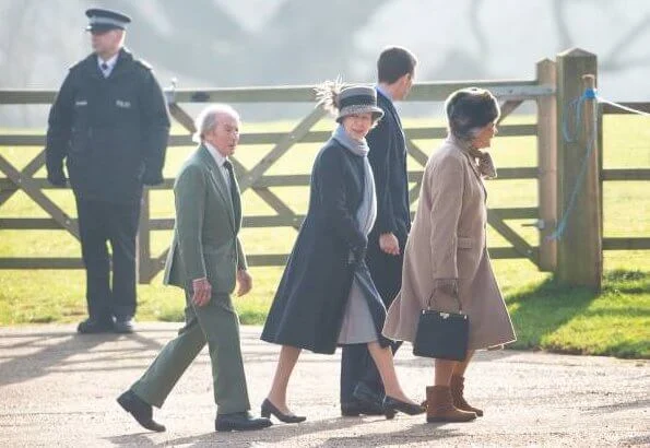 The Queen wore a bright orange jacket and a furry black hat, while Princess Anne donned a  navy coat.  Dame Kiri Te Kanawa