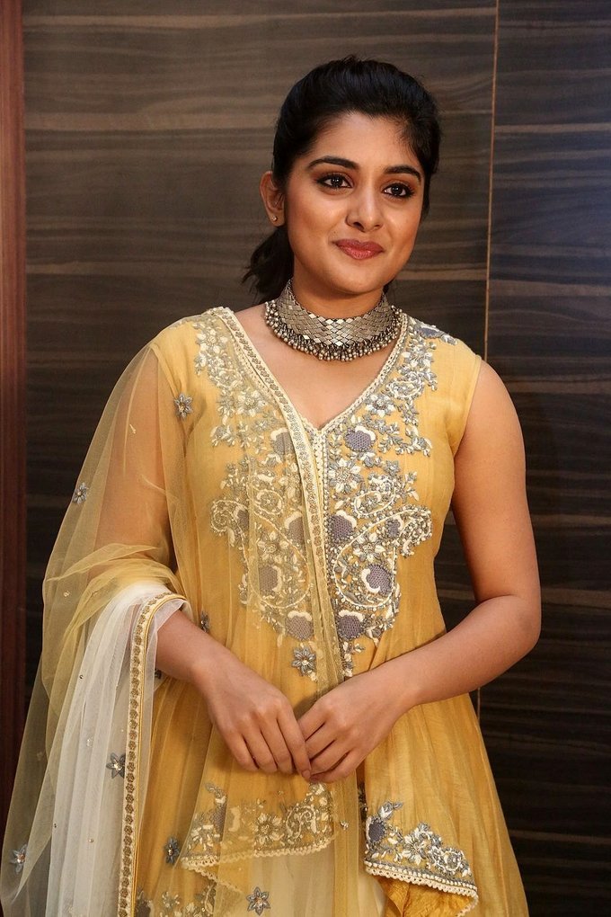 Beautiful Telugu Girl Niveda Thomas Long Hair Photos In Yellow Dress
