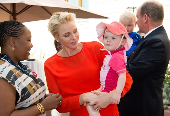 Prince Albert, Princess Charlene, Prince Jacques, Princess Gabriella of Monaco. Princess Charlene Armani Prive Dress, Jeweler diamond earrings, royal family