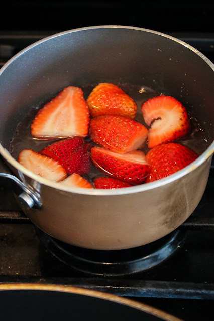 simmering strawberries to make a simple syrup