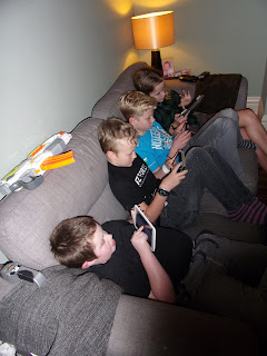 sofa full of boys on tablets