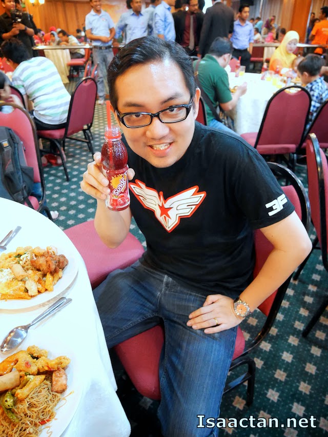 Just a candid moment, posing with one of Pran's product, the Sundrop Pomegranate drink