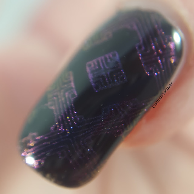 A purple to pink multi-chrome nail polish with flashes of gold and green.